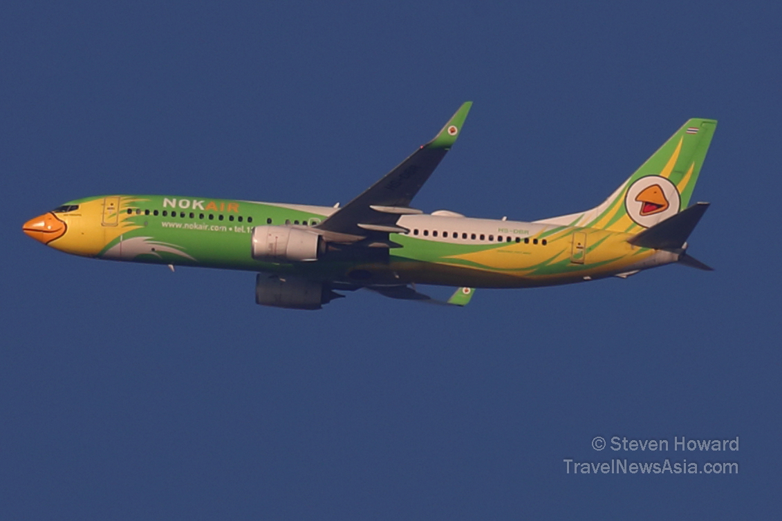 Nok Air Boeing 737 reg: HS-DBR flying from DMK to CNX on 8 December 2021. Picture by Steven Howard of TravelNewsAsia.com Click to enlarge.