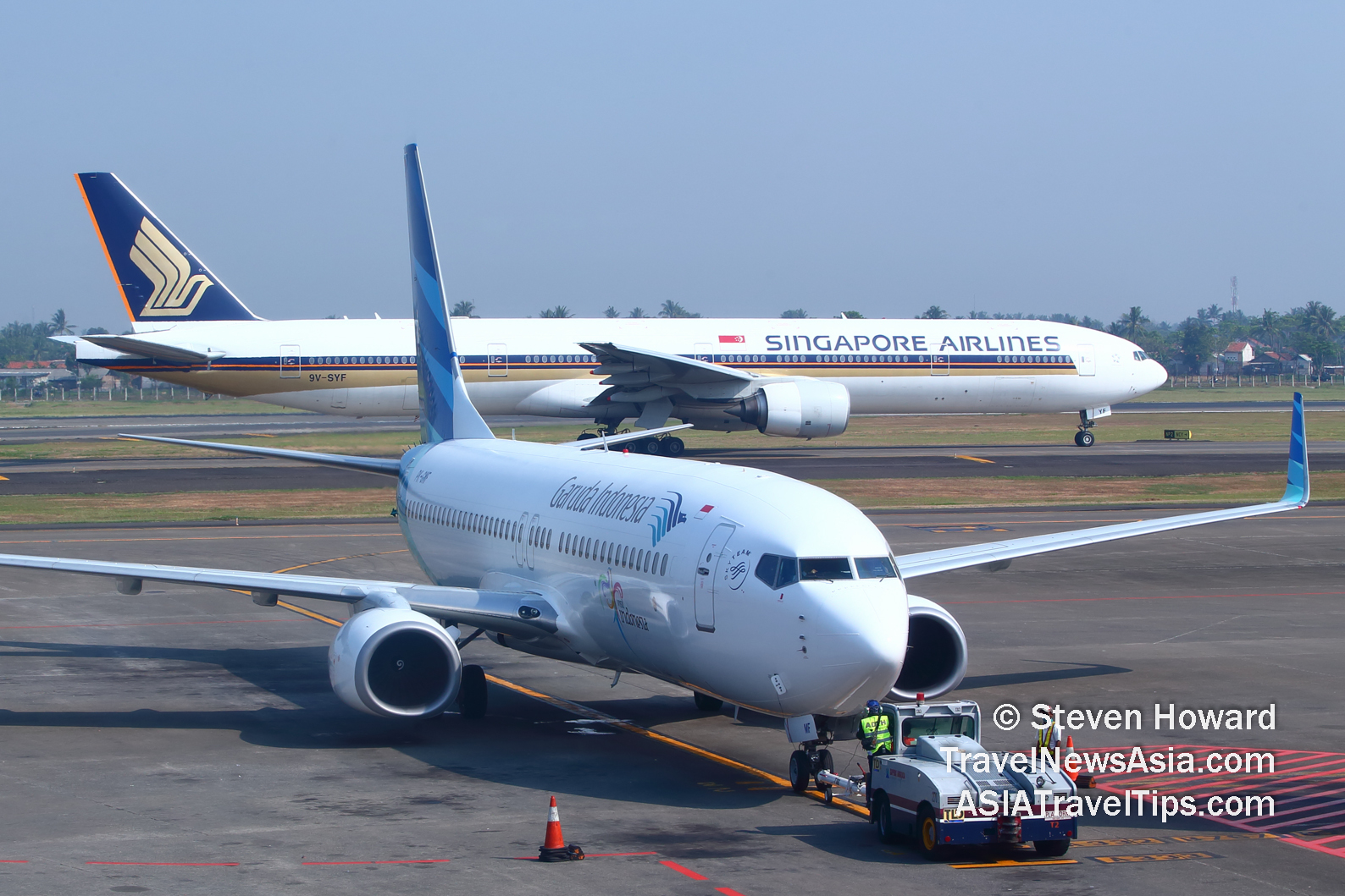 Garuda Indonesia and Singapore Airlines at Jakarta Airport. Picture by Steven Howard of TravelNewsAsia.com Click to enlarge.