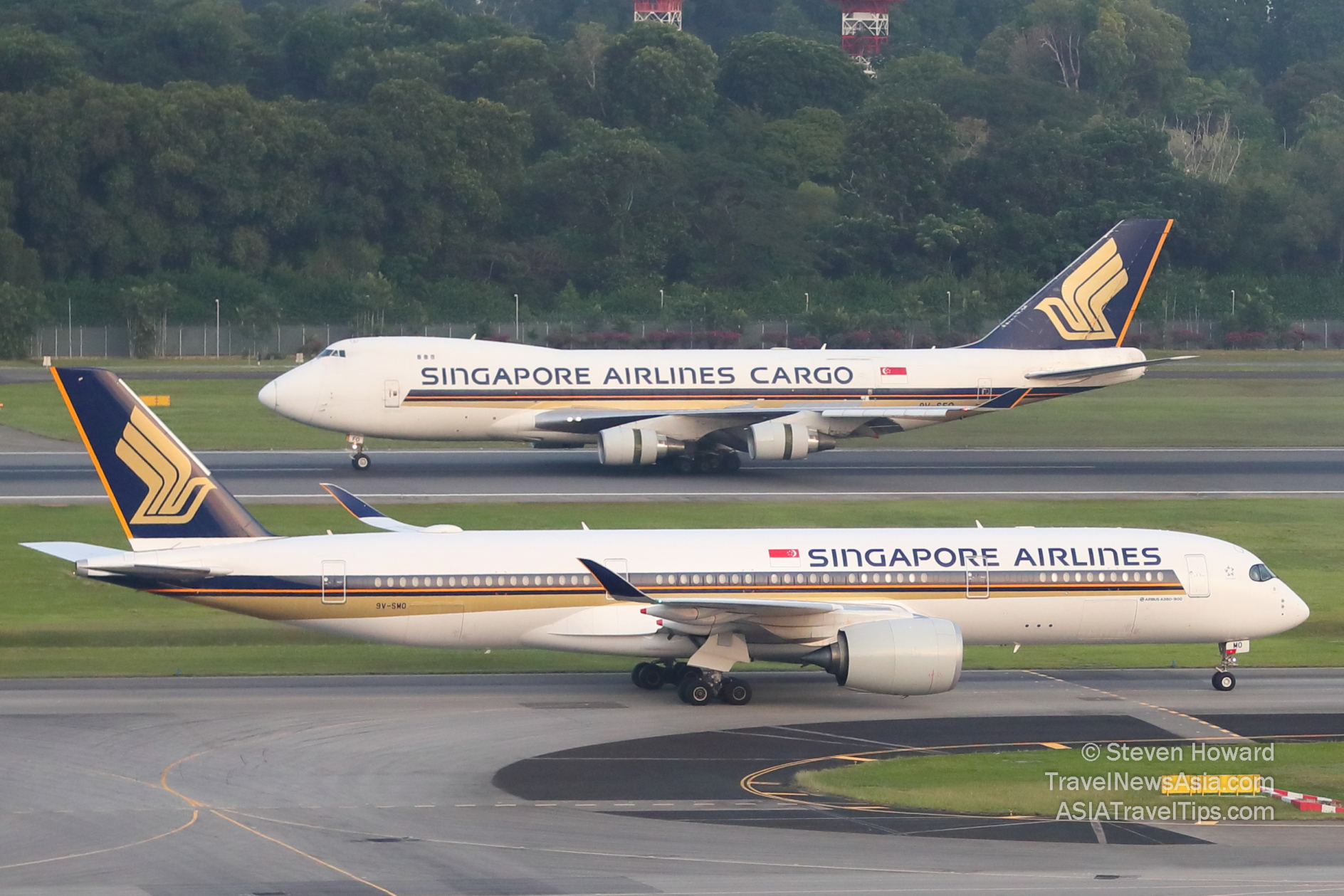 Singapore Airlines will use the Airbus A350F to replace the Boeing 747Fs in its fleet. Picture of a Boeing 747F in the background with an Airbus A350-900 in the foreground. Picture by Steven Howard of TravelNewsAsia.com Click to enlarge.