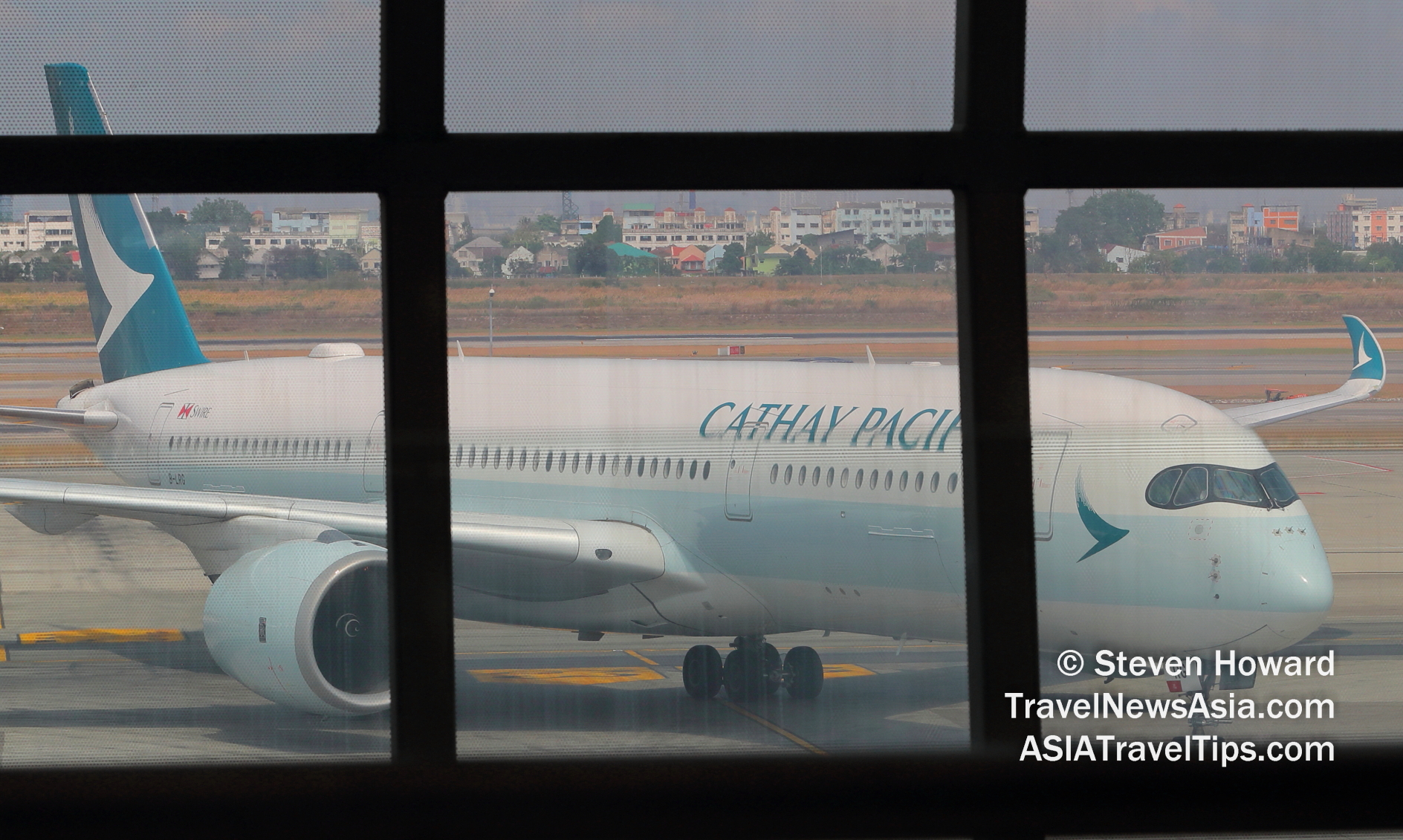 Cathay Pacific Airbus A350 at BKK. Picture by Steven Howard of TravelNewsAsia.com Click to enlarge.