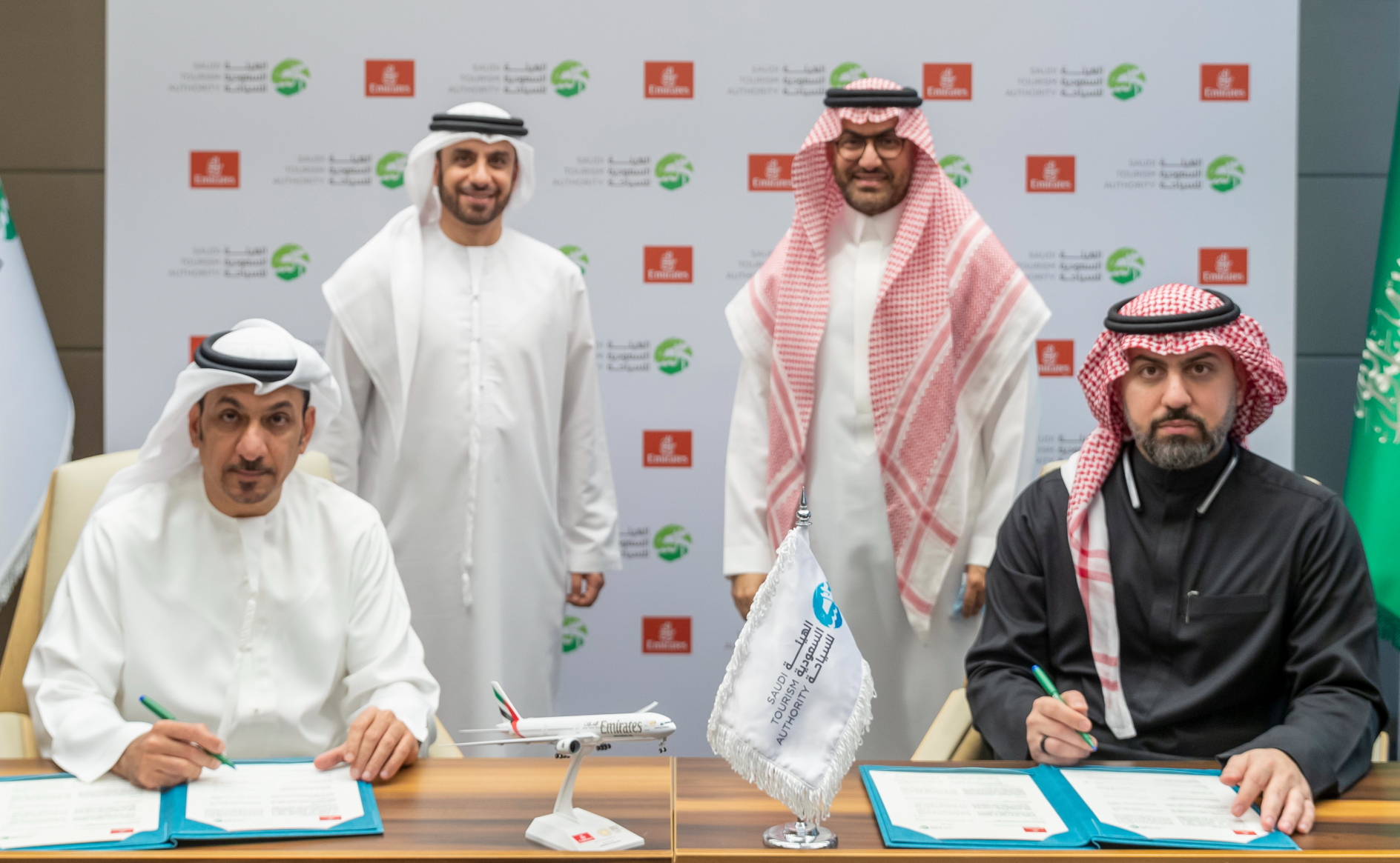 The MOU was signed by Adil Al Ghaith (left), Emirates' Senior Vice President Commercial Operations, Gulf, Middle East and Central Asia, and Muhammad Bassrawi, VP of the Saudi Tourism Authority, in the presence of Mr. Fahd Hamidaddin, CEO and Board Member of the Saudi Tourism Authority and Adnan Kazim, Emirates’ Chief Commercial Officer.. Click to enlarge.