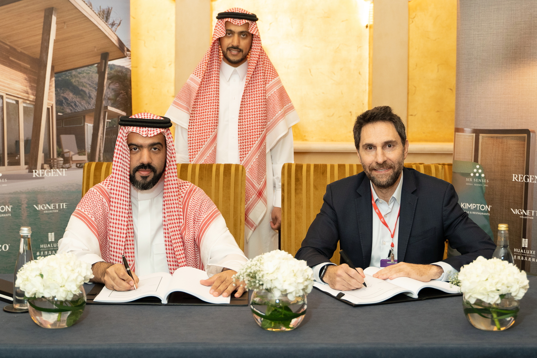 Ajlan Al Ajlan (left) signing the hotel management contract with Haitham Mattar. Click to enlarge.