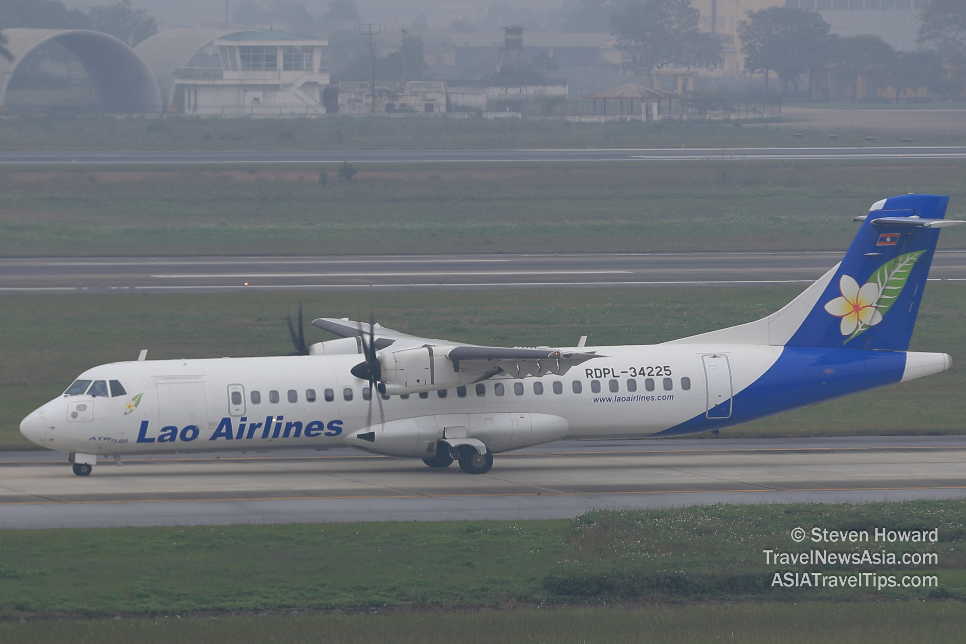 Lao Airlines ATR 72-600 reg: RDPL-34225 on a foggy day at HAN. Picture by Steven Howard of TravelNewsAsia.com Click to enlarge.