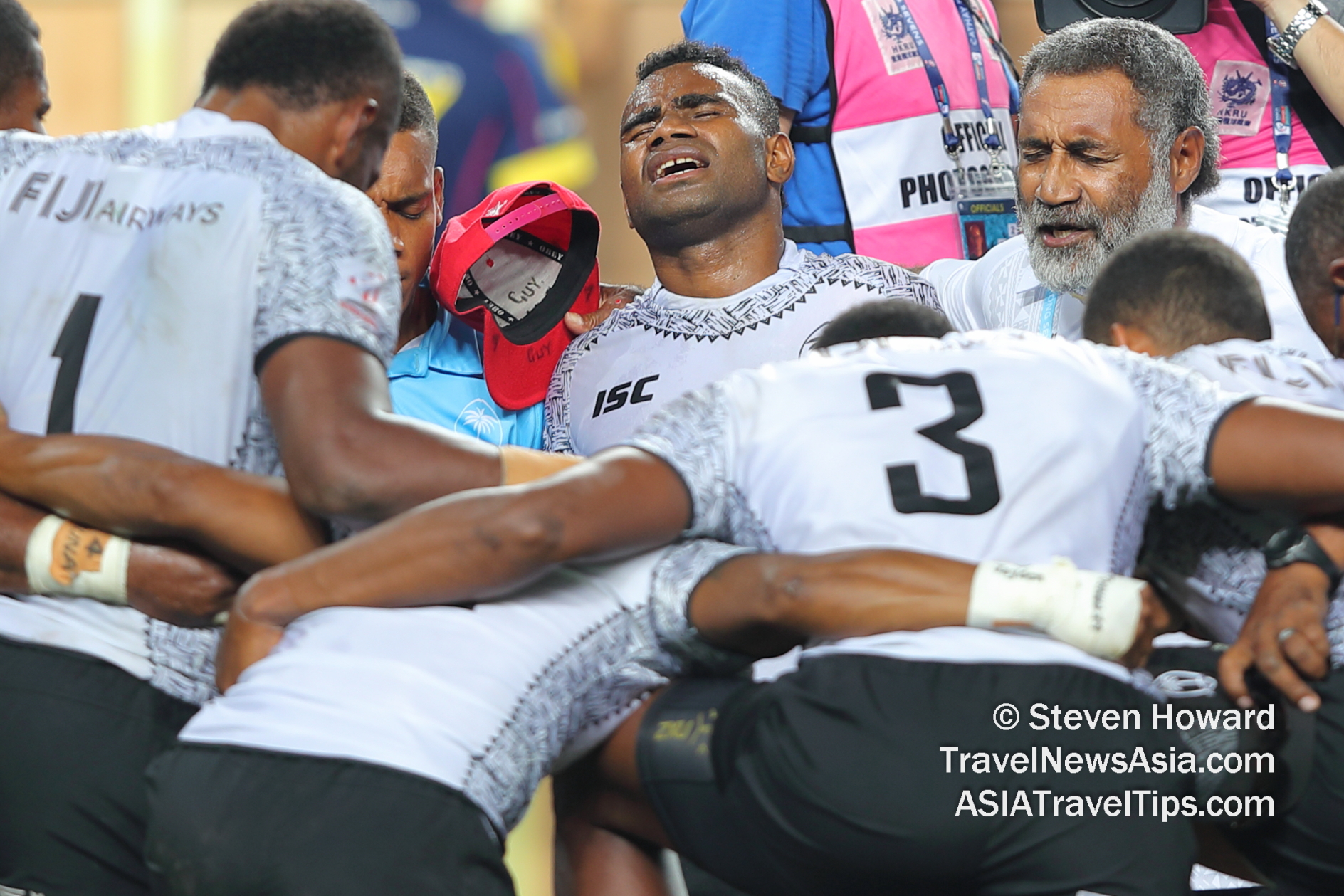 Fiji Sevens team praying after record 5th consecutive victory at HK7s in 2019. Picture by Steven Howard of TravelNewsAsia.com Click to enlarge.
