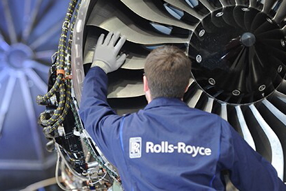 Technician works on a Rolls-Royce engine. Click to enlarge.