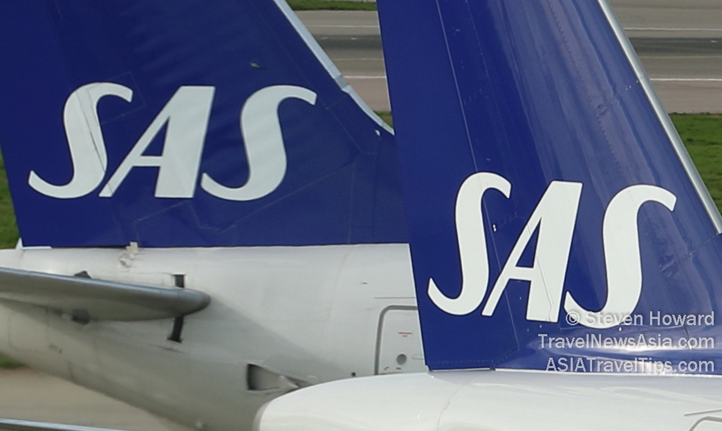 Tailfins of two Scandinavian Airlines (SAS) Airbus A320 aircraft. Click to enlarge.