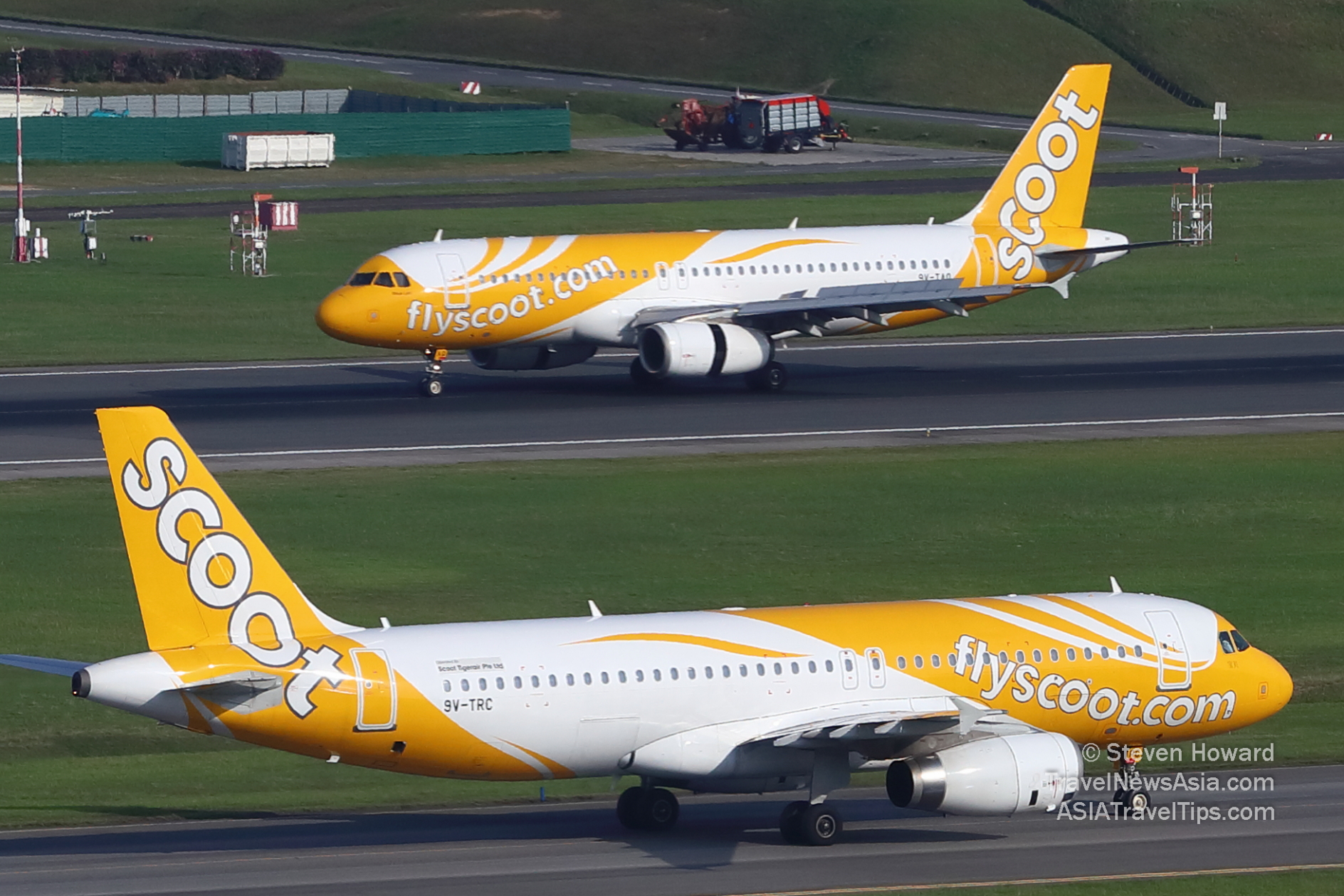 Two Scoot A320s at Changi. Picture by Steven Howard of TravelNewsAsia.com Click to enlarge.