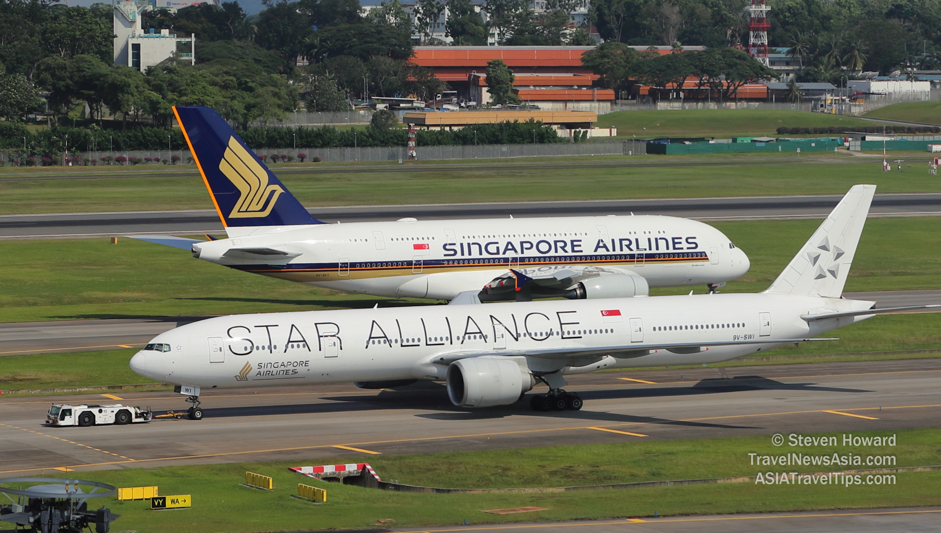 Singapore Airlines A380 and B777 at Changi. Picture by Steven Howard of TravelNewsAsia.com Click to enlarge.