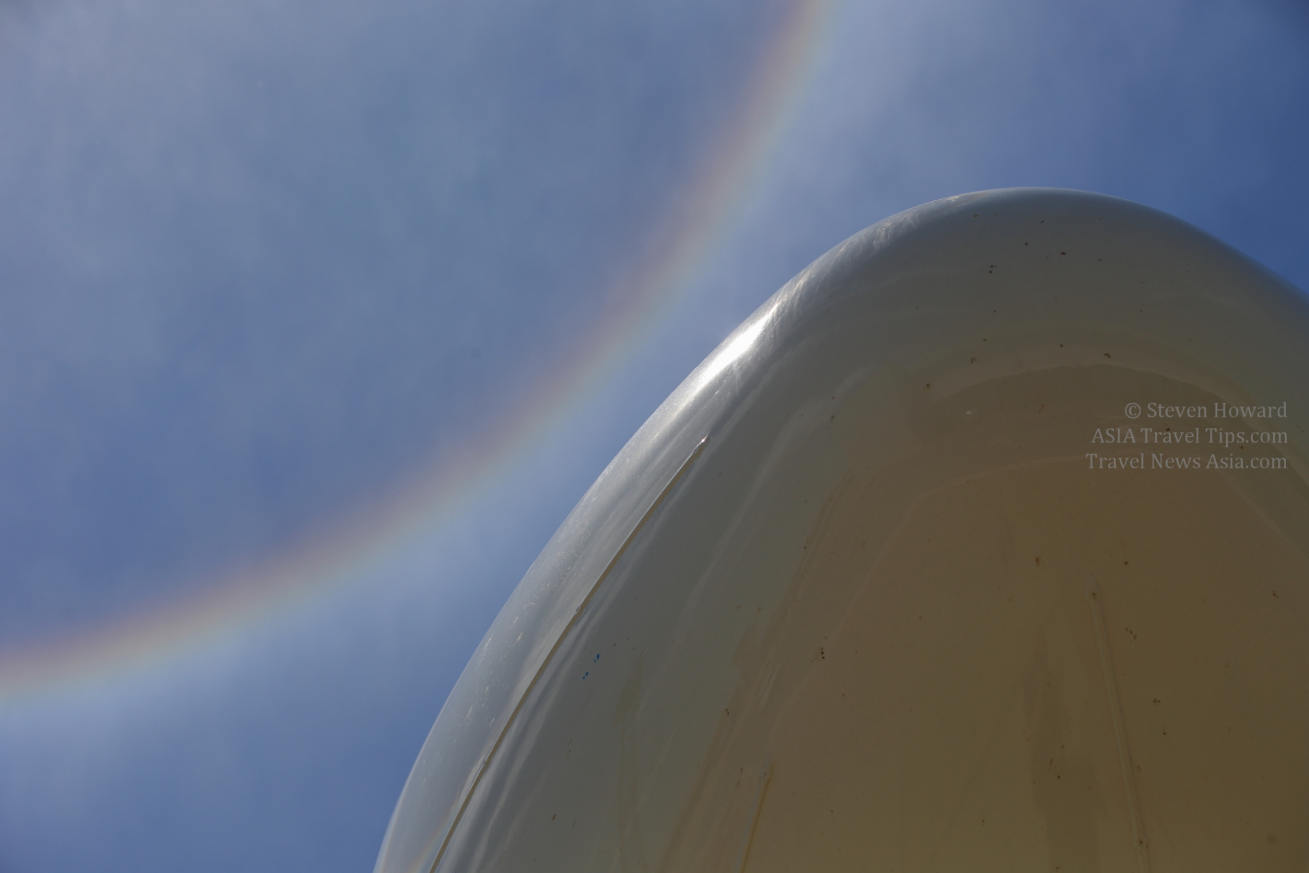 Nose of a Thai AirAsia X A330 with a sunbow in the sky. Picture by Steven Howard of TravelNewsAsia.com Click to enlarge.