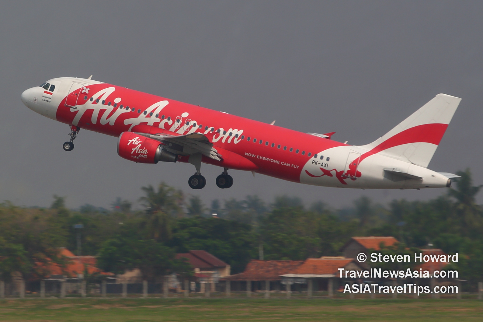 Air Asia Indonesia A320 reg: PK-AXI. Picture by Steven Howard of TravelNewsAsia.com Click to enlarge.