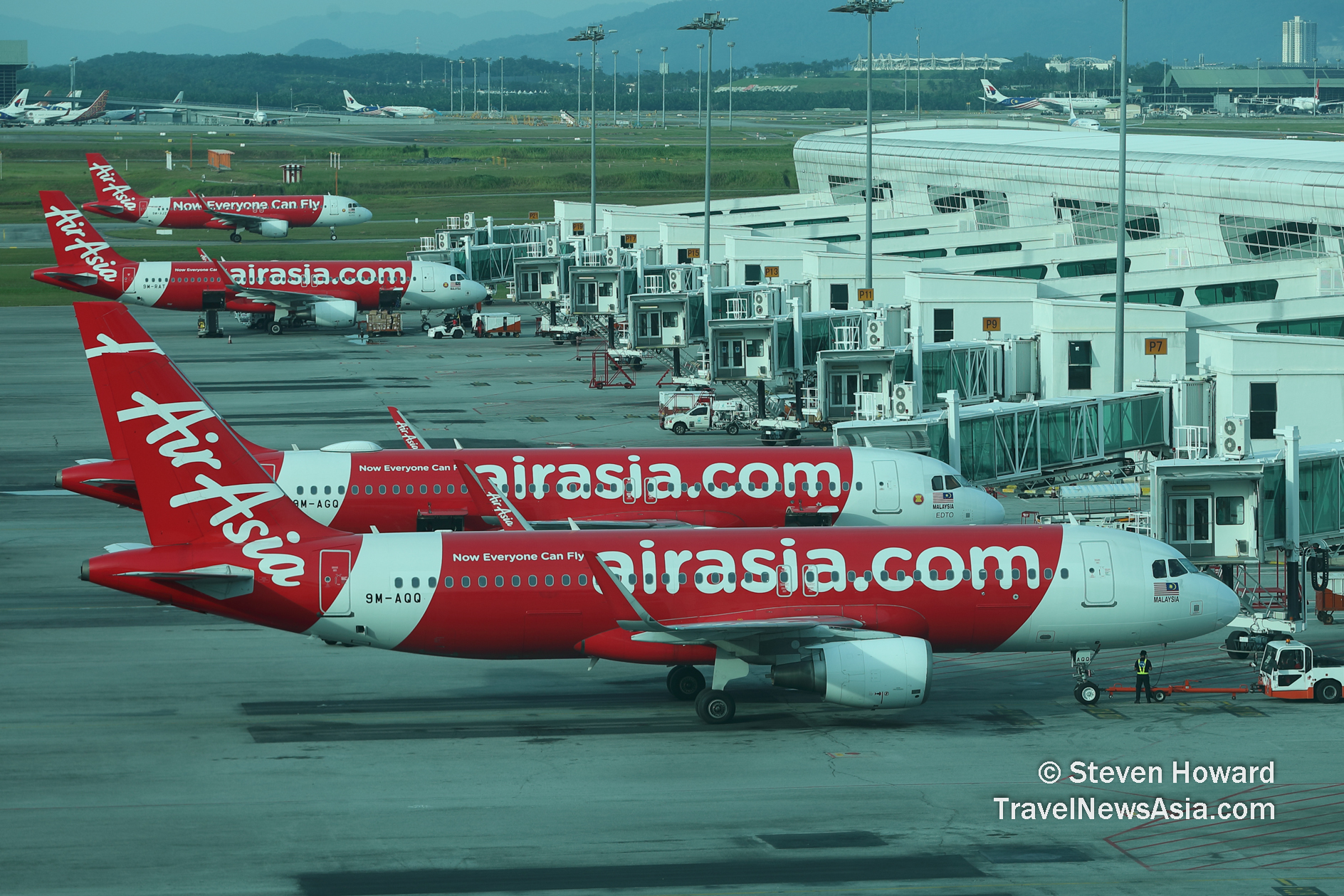 AirAsia Malaysia A320s at klia2. Picture by Steven Howard of TravelNewsAsia.com Click to enlarge.