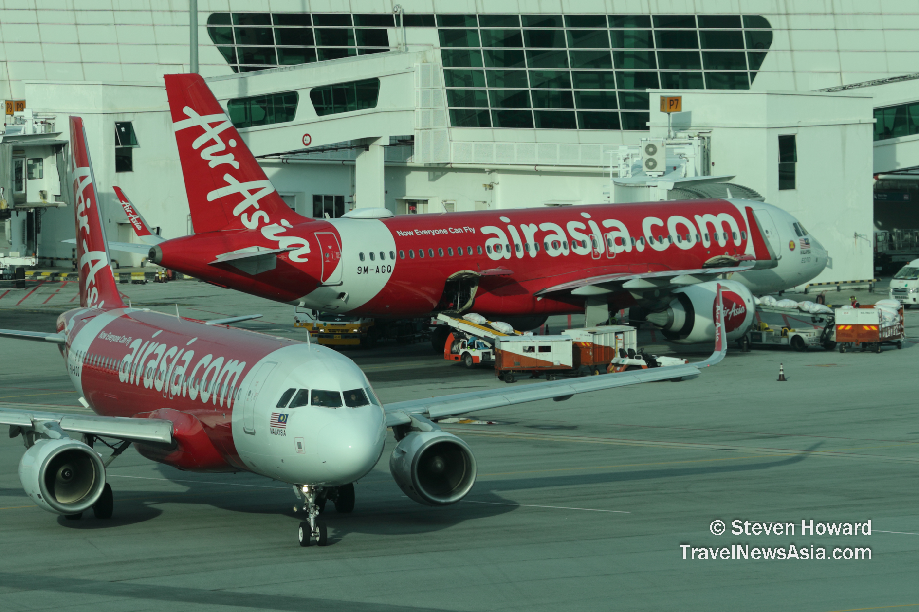 AirAsia Malaysia A320s at KUL. Picture by Steven Howard of TravelNewsAsia.com Click to enlarge.