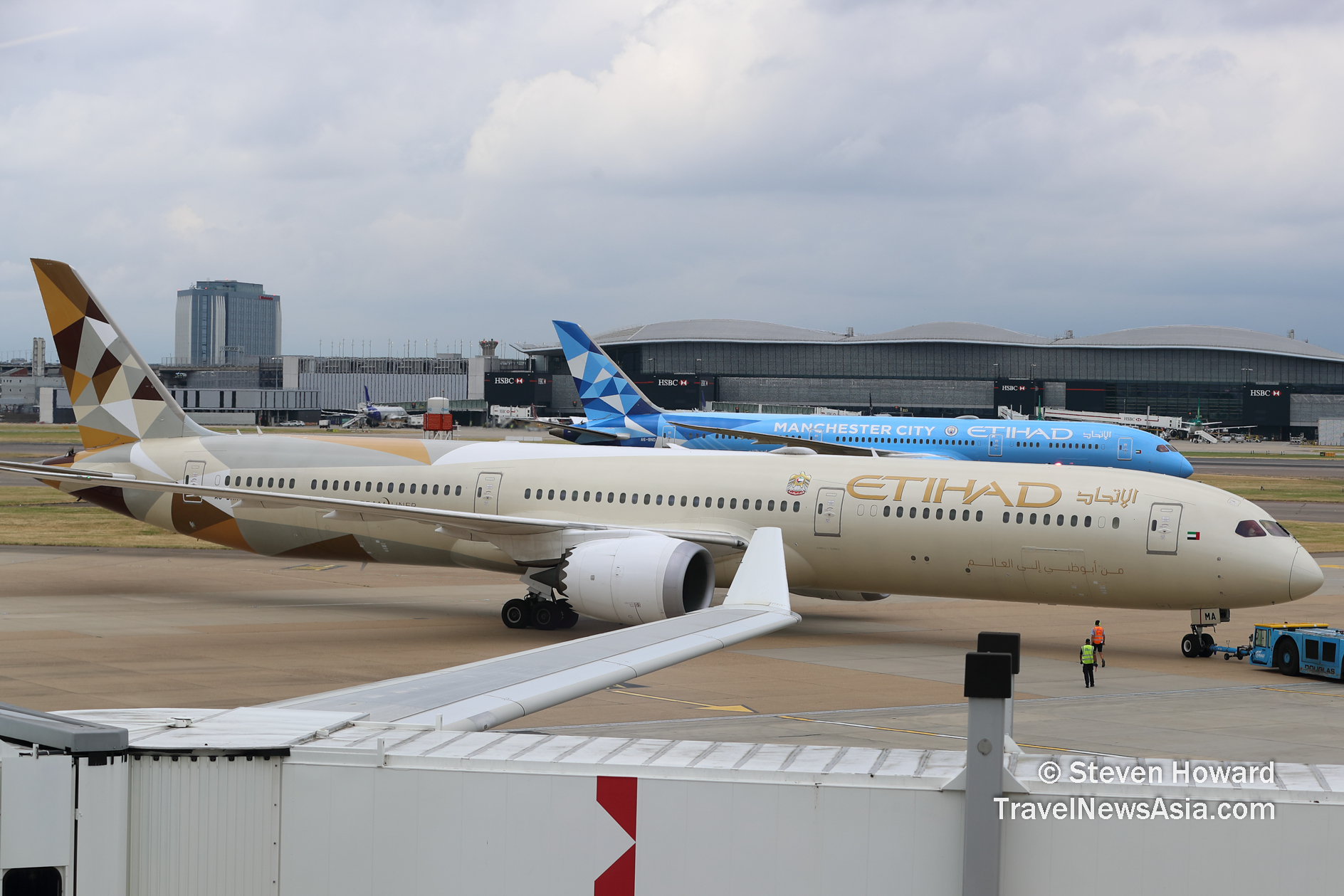 Two Etihad Airways aircraft. Picture by Steven Howard of TravelNewsAsia.com Click to enlarge.