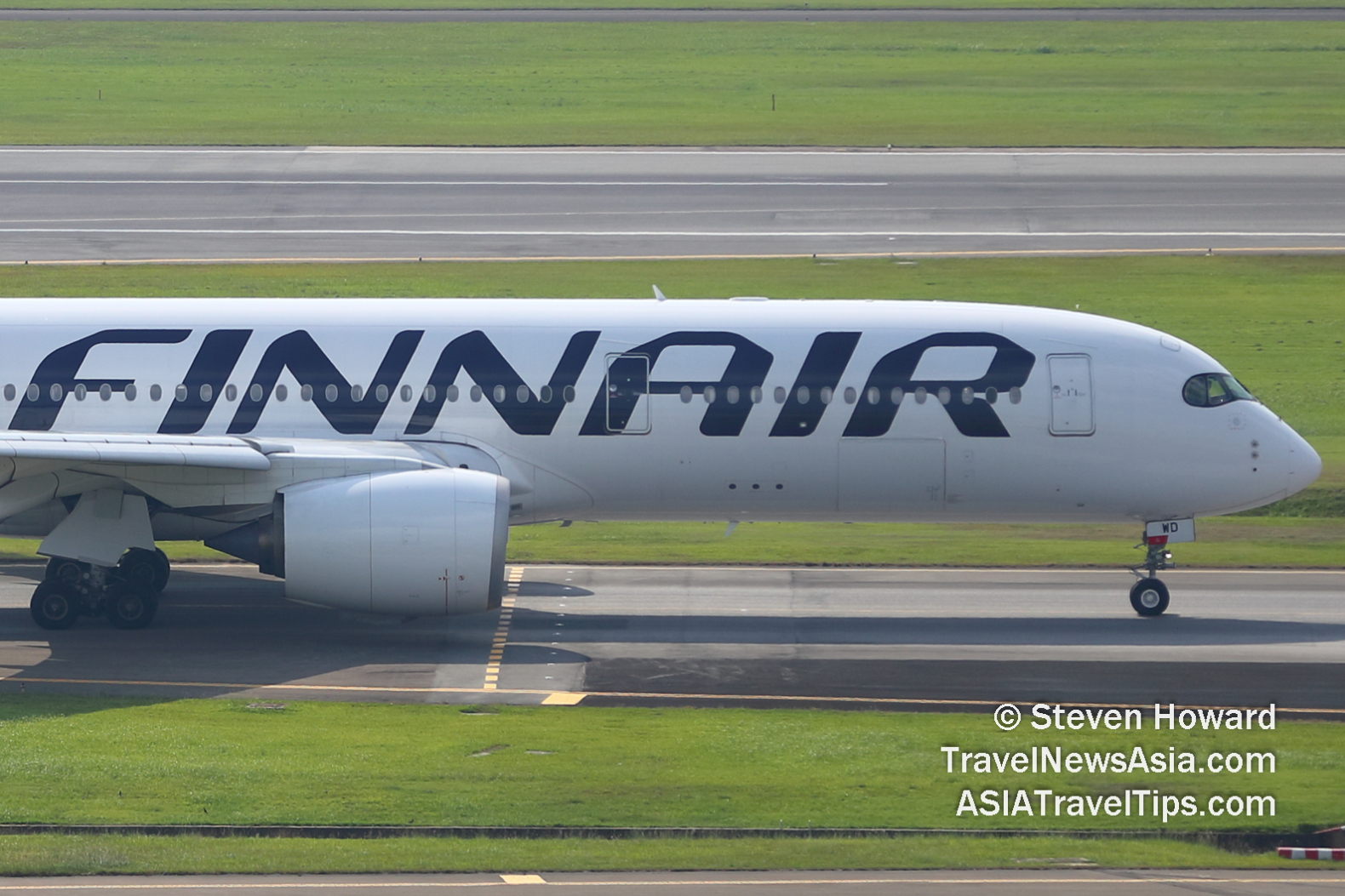 Finnair A350-900 reg: OH-LWD. Picture by Steven Howard of TravelNewsAsia.com Click to enlarge.