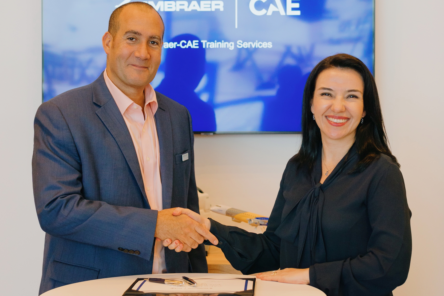 Michel Azar-Hmouda, CAE's VP Global Commercial Aviation Training (left) with Lais Port Antunes, Services & Support Director, Commercial Aviation (APAC), Embraer Services & Support. Click to enlarge.