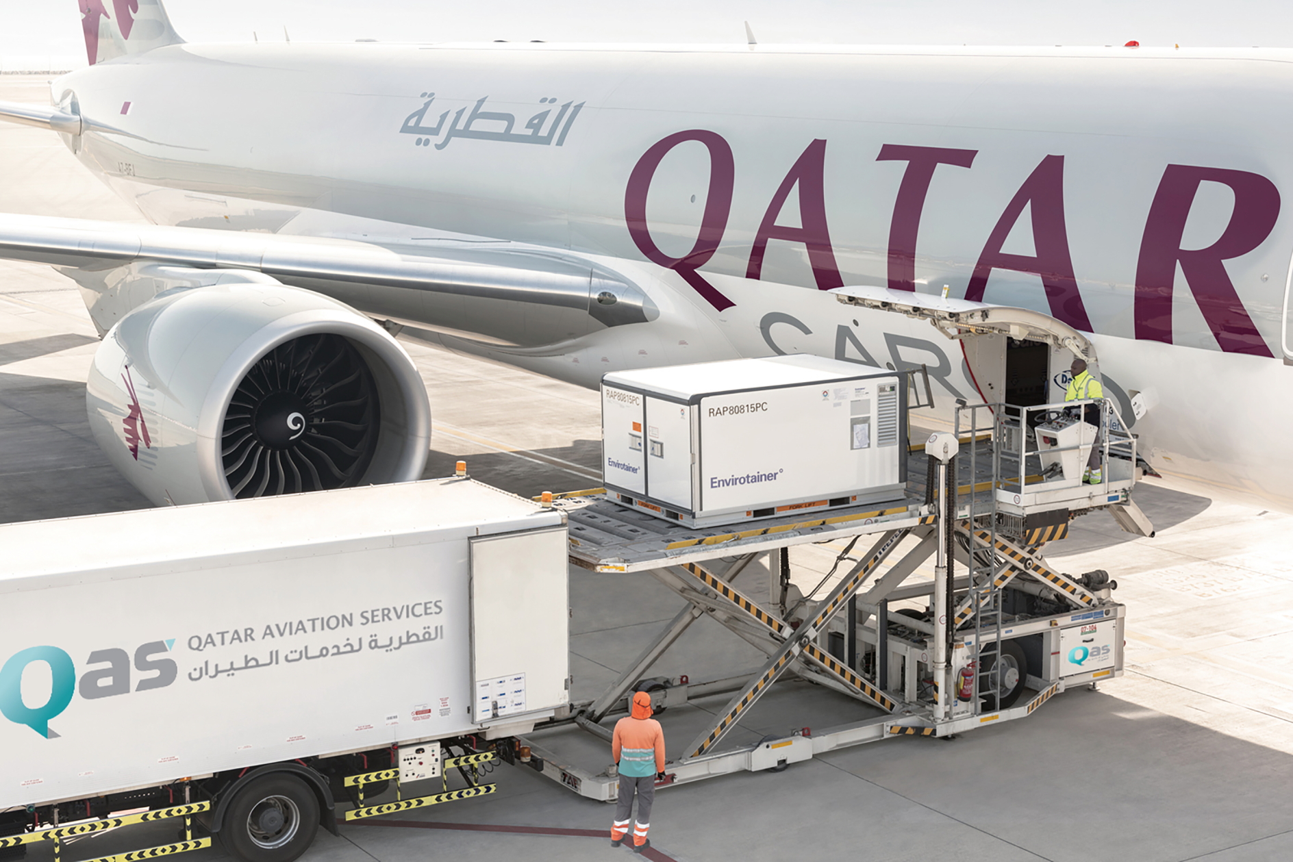 Qatar Aviation Services loading cargo onto a freighter. Click to enlarge.