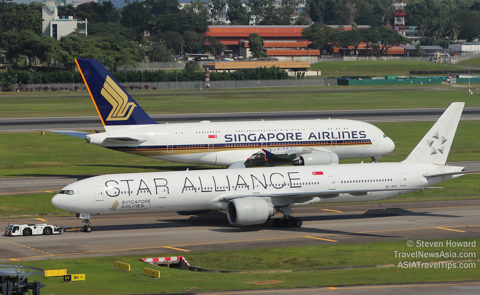Singapore Airlines A380 and B777 at Changi Airport. Picture by Steven Howard of TravelNewsAsia.com Click to enlarge.